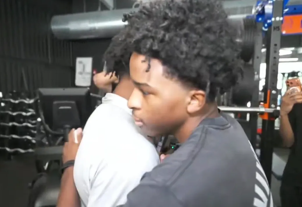 Nitro Camden and IShowSpeed sharing a quick embrace inside a gym after the greeting.