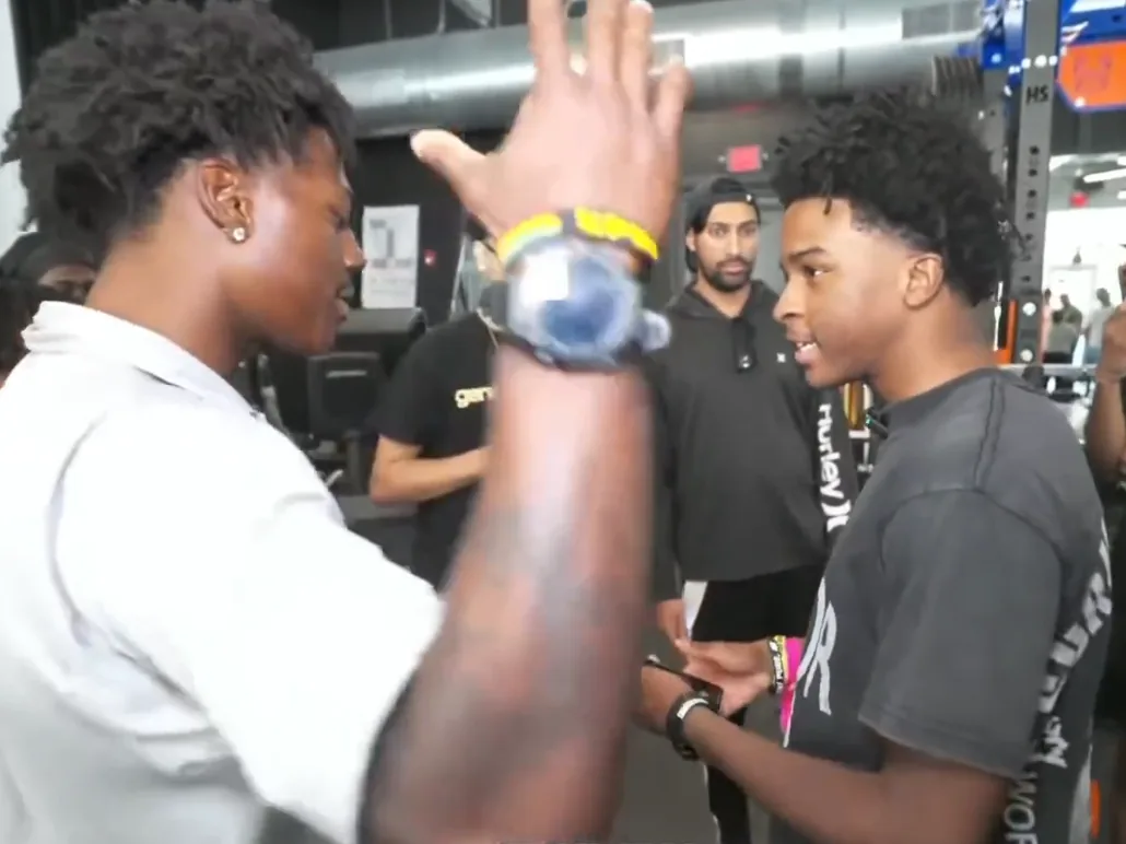 IShowSpeed greeting Nitro Camden inside a gym during a livestream.